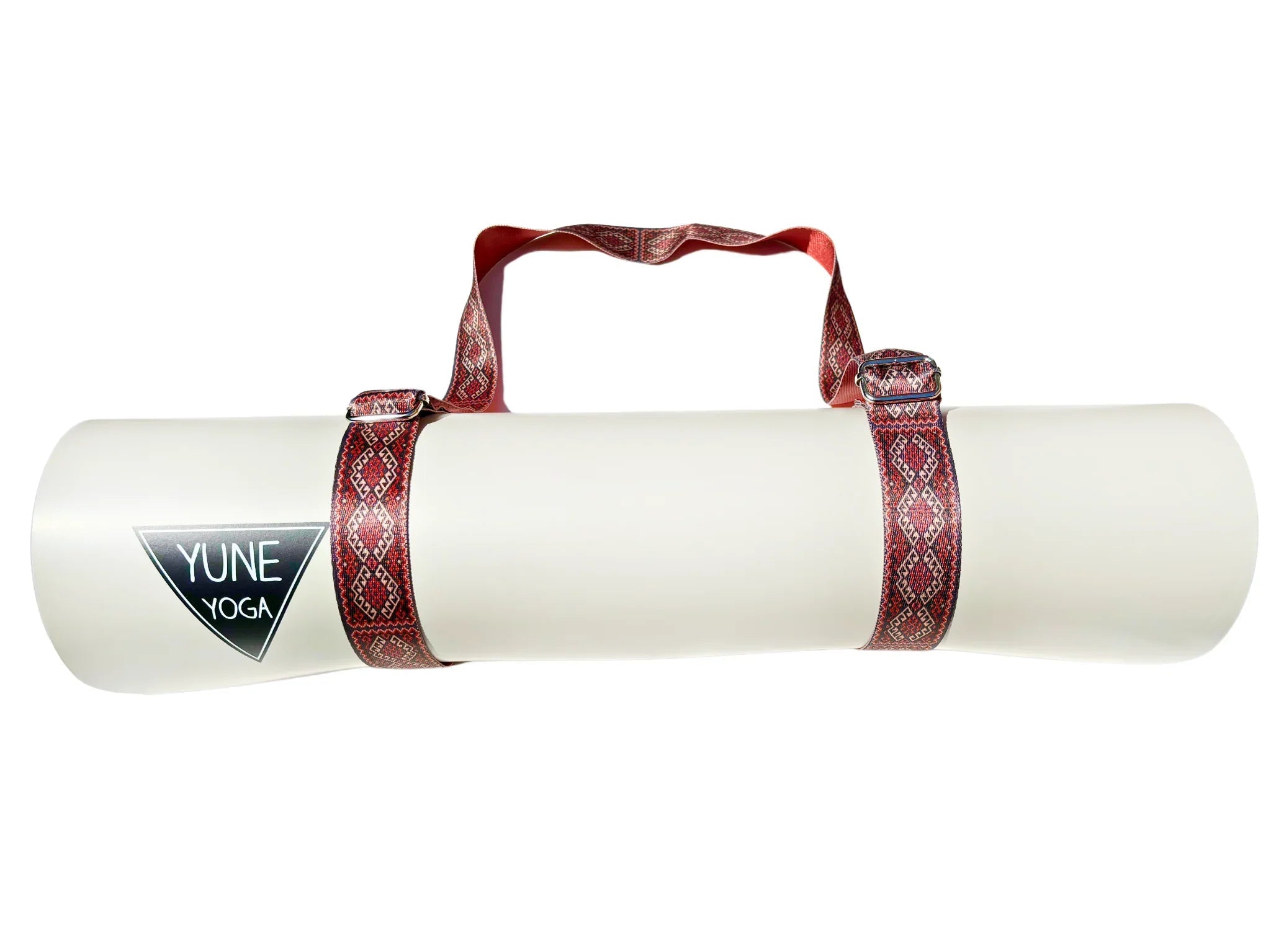 Warm red organic cotton yoga strap with metal D-ring buckles rolled up for studio practice — view 4