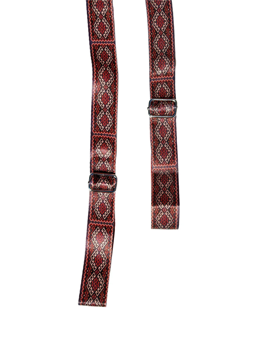 Warm red organic cotton yoga strap with metal D-ring buckles rolled up for studio practice — view 2
