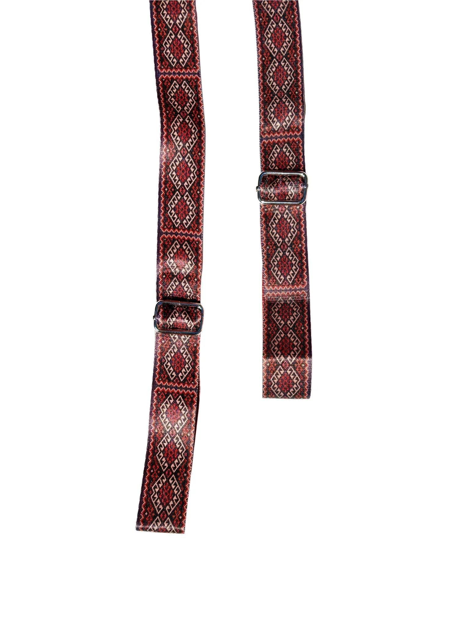 Warm red organic cotton yoga strap with metal D-ring buckles rolled up for studio practice — view 2